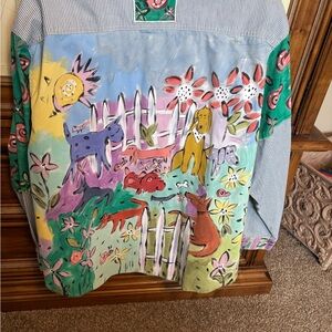 This shirt is awesome bought at a craft fair, no brand or size I’m guessing 1X